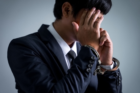 businessman in handcuffs